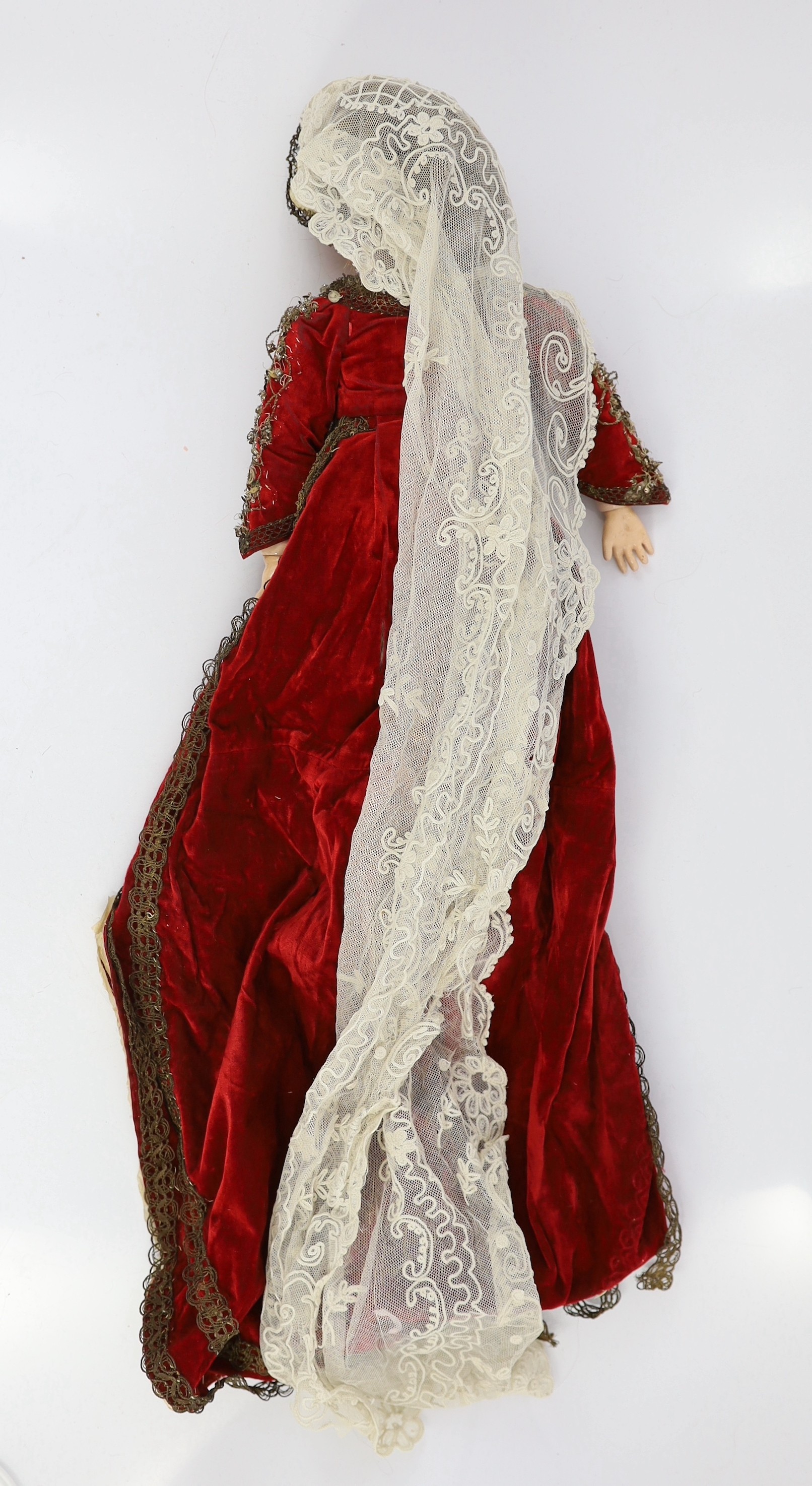 A Simon & Halbig bisque doll, mould 1078, sleeping eyes and open mouth, jointed wood and composition body, sequinned cream and red velvet dress, 19in.